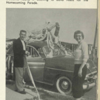 Two students with their homecoming float.  The caption states "Students found it exciting to build floats for the Homecoming Parade."
