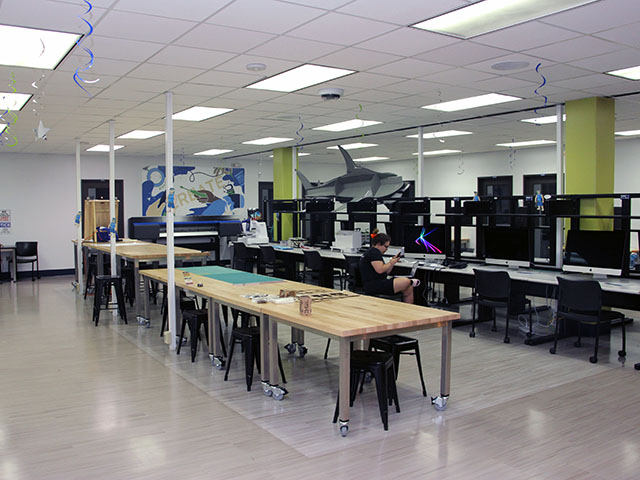 I-Create Lab space with work tables, study carrels, computers, printers, and other equipment