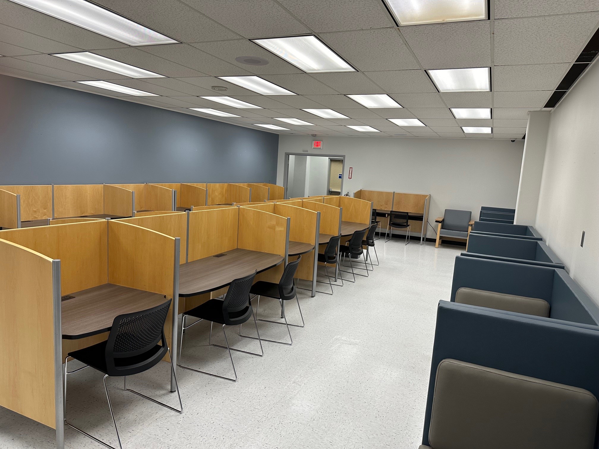 Inside Study Space room showing study carrels, chairs, and other seating