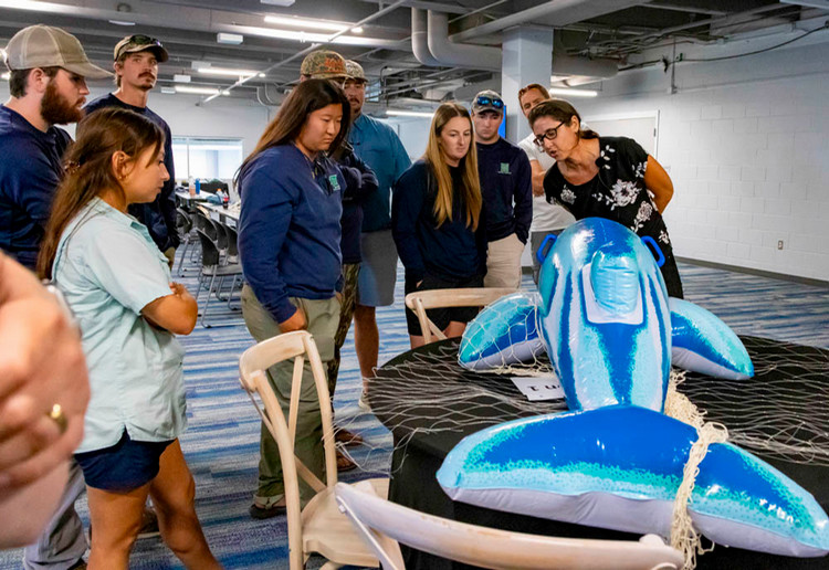 Dr.+Dara+Orbach+instructs+Texas+Parks+and+wildlife+Department+Personnel+on+proper+dolphin+disentanglement+procedures