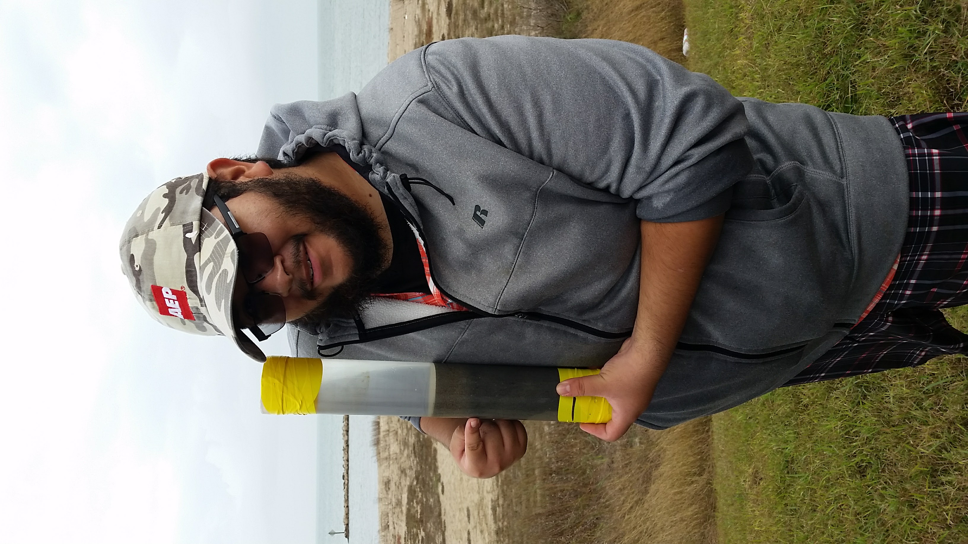 Cody Lopez holding a sediment core